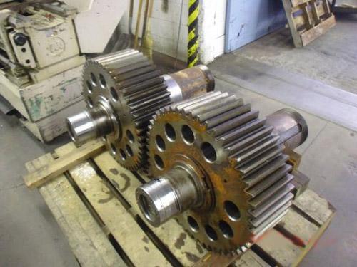 A geared shaft assembly repaired with flame sprayed stainless steel.