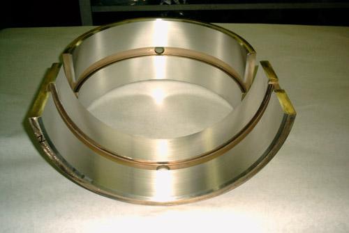A Babbitt bearing shell after flame spray and finish machining.