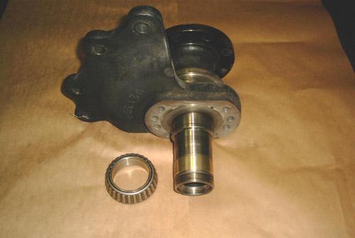 A housing bearing fit repaired with flame sprayed aluminum bronze, with its roller bearing.
